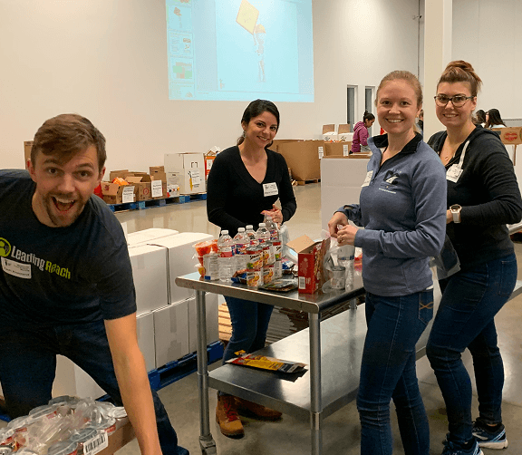 Employees volunteering together during a community service activity.