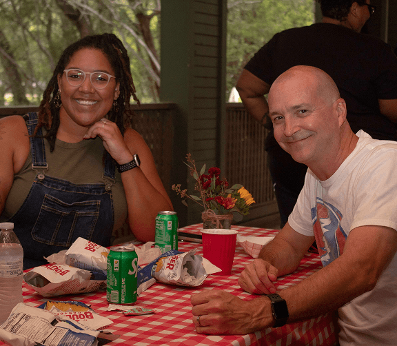 Employees enjoying a meal together during a team gathering.
