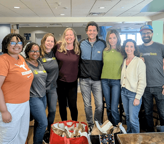 Employees gathered together during a workplace celebration.