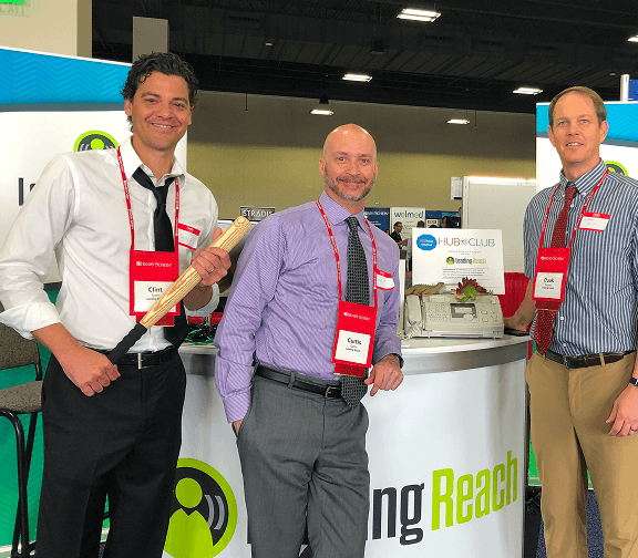 Employees representing the company at an industry conference.