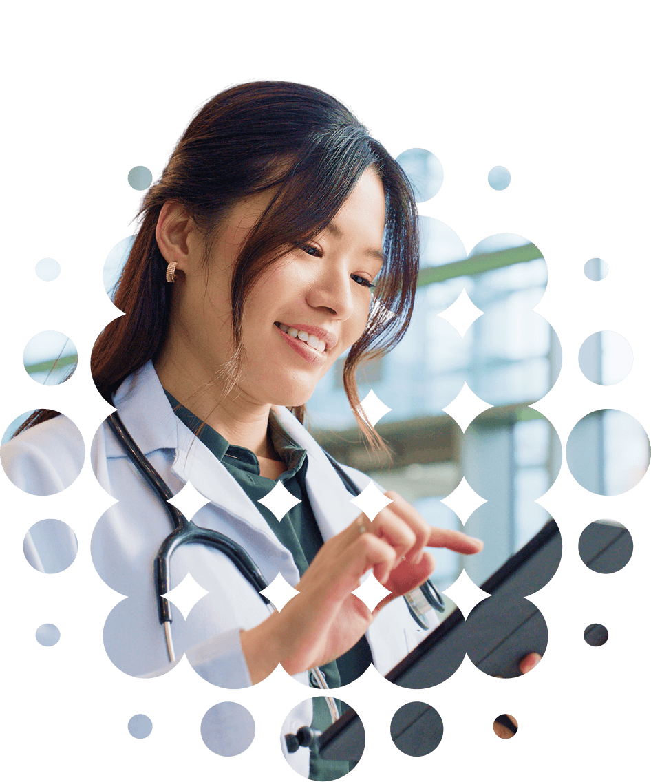 Photo of smiling female doctor using tablet computer